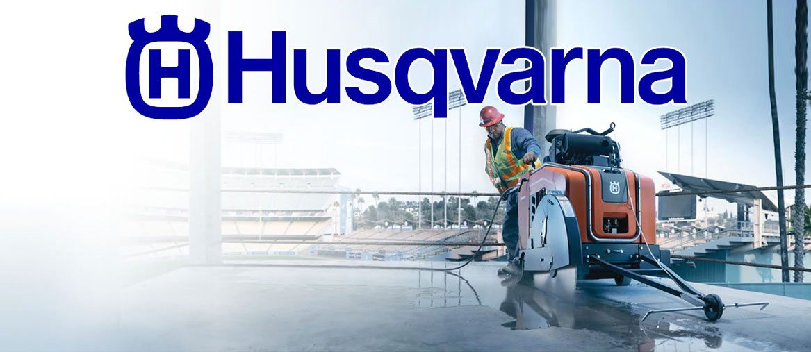 concrete contractor using a Husqvarna floor saw to complete a project at a stadium