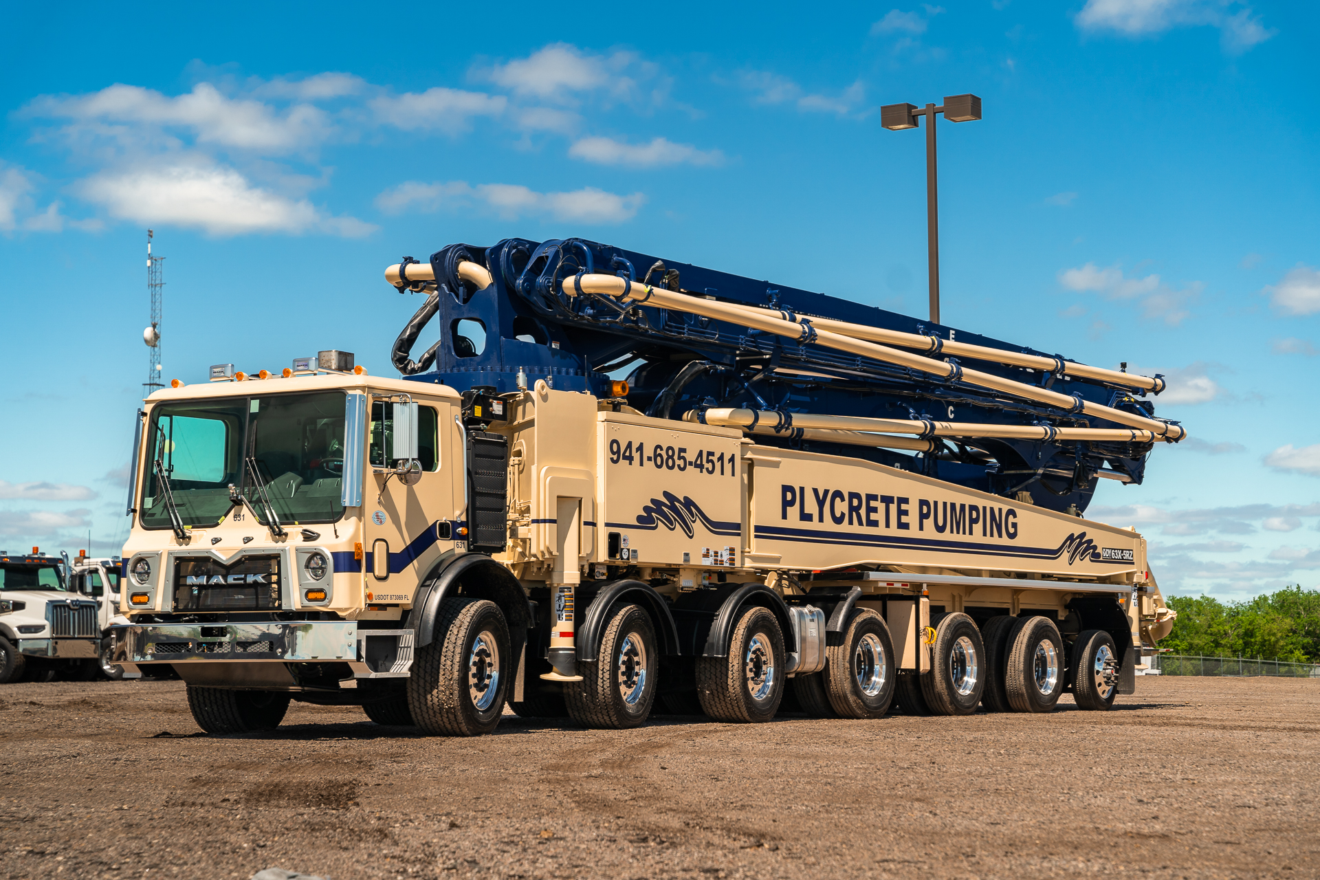 A new DY 63X-5RZ truck-mounted concrete boom pump for Plycrete Pumping, photographed in the back yard of the DY Concrete Pumps’ Texas headquarters.