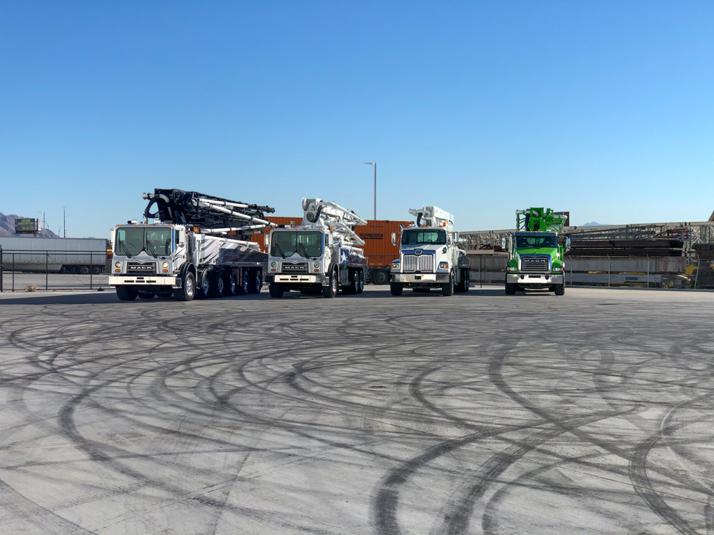 4 DY Concrete Pumps lined up outside of the WOC event