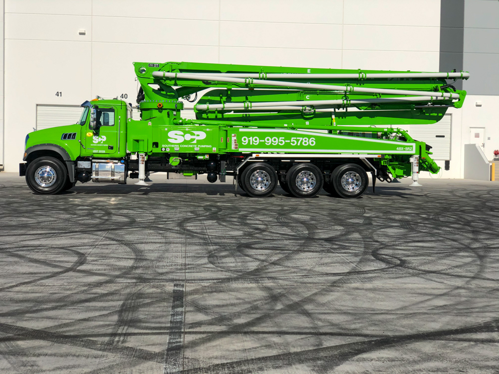 lime green DY concrete pump on display at the WOC event