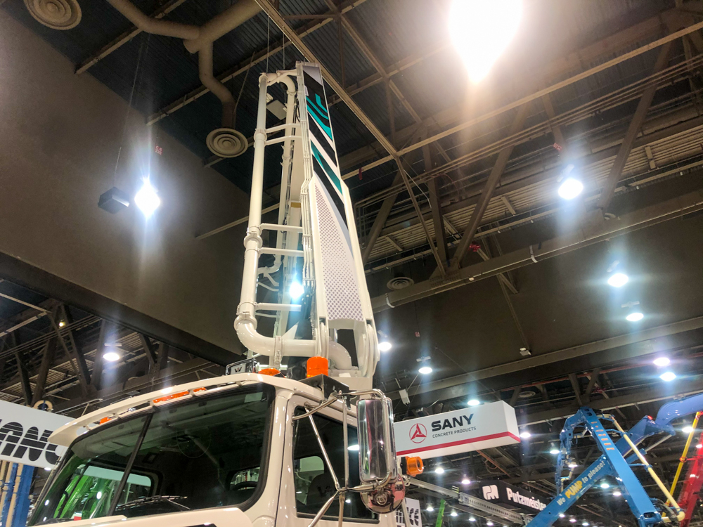 DY concrete pump with arm extended on display at the WOC event