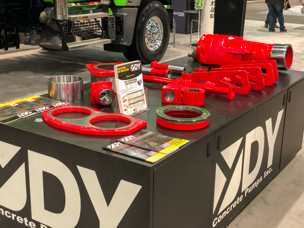 various DY concrete pump parts on display at the World of Concrete event
