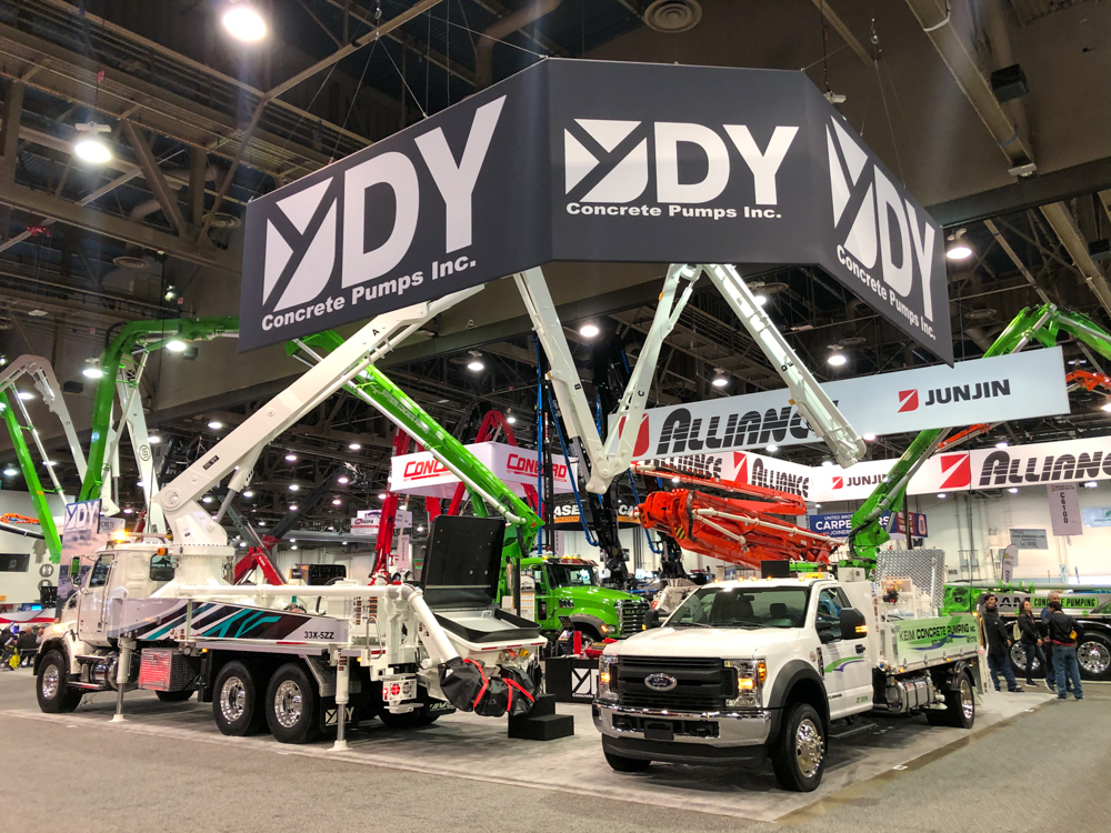 DY Concrete Pumps display inside of the World of Concrete event