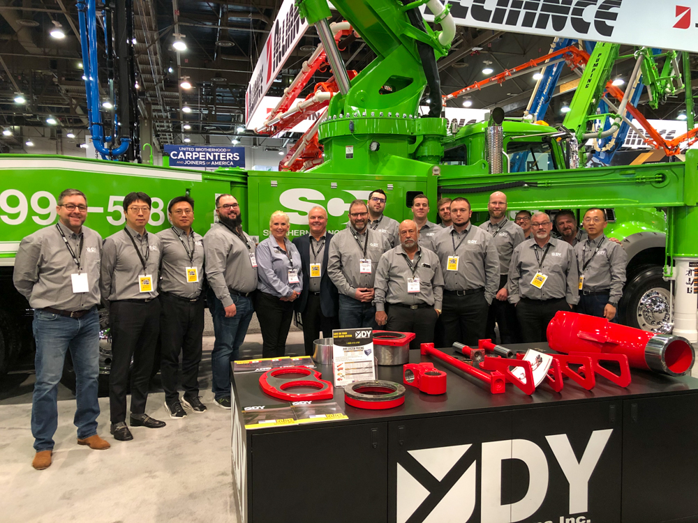 The DY concrete Pumps team at the DY display in the WOC event