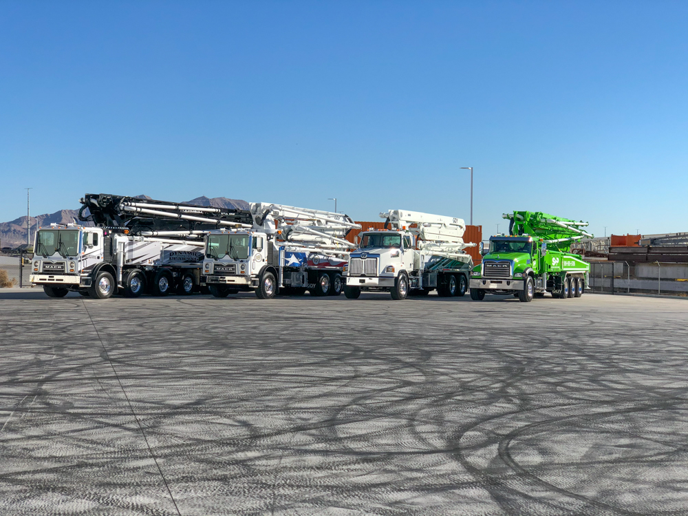 different DY concrete pumps lined up outside of the WOC event