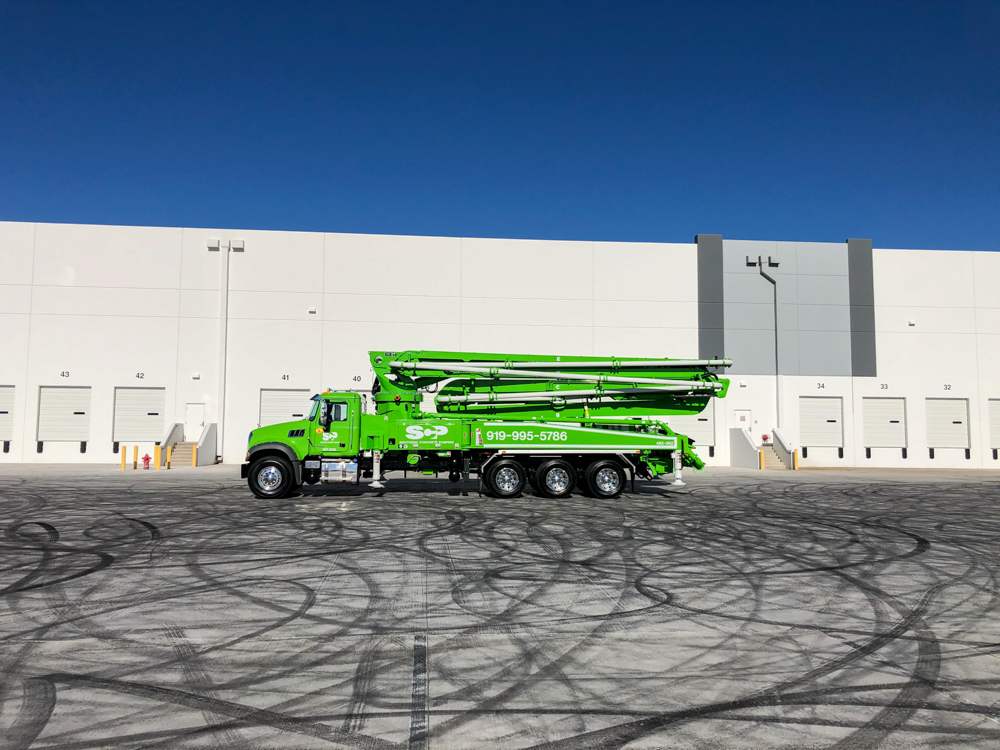 green DY concrete pump manufactured for Southern Concrete Pumping at the 2020 WOC event