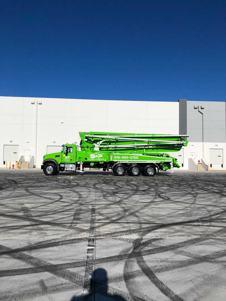green Southern Concrete Pumping concrete pump truck on display at the 2020 WOC event
